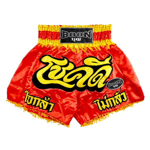 Red Boon traditional Muay Thai shorts with yellow Thai script and black Boon logo patch