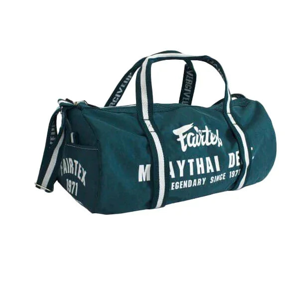Fairtex barrel bag in teal with Muay Thai design and white logo, duffel style gym bag