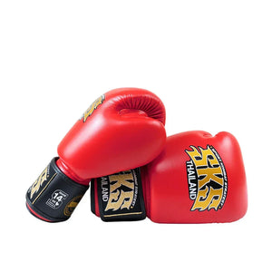Red SKS Empire microfiber Muay Thai boxing gloves with gold logo on white background