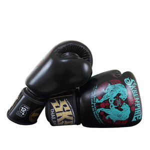 Black Muay Thai boxing gloves with blue tiger print, SKS Empire branding, and 12oz label
