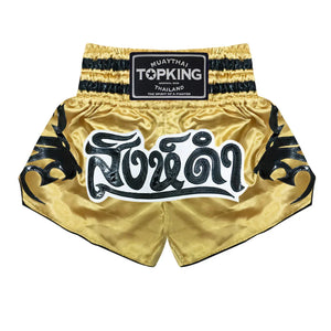 Top King Muay Thai shorts gold with black tiger design and Thai script, martial arts gear