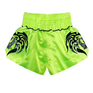 Neon green Top King Muay Thai shorts with black dragon design for kickboxing