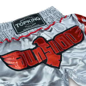 Top King Muay Thai shorts silver with red eagle embroidery and Thailand logo patch