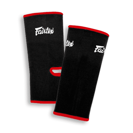 Fairtex Muay Thai ankle guards in black and red, showing the reinforced edging
