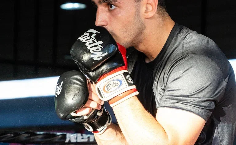 Man with FGV18 Fairtex MMA gloves on