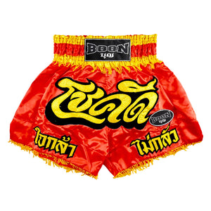 Red Boon traditional Muay Thai shorts with yellow Thai script and black Boon logo patch