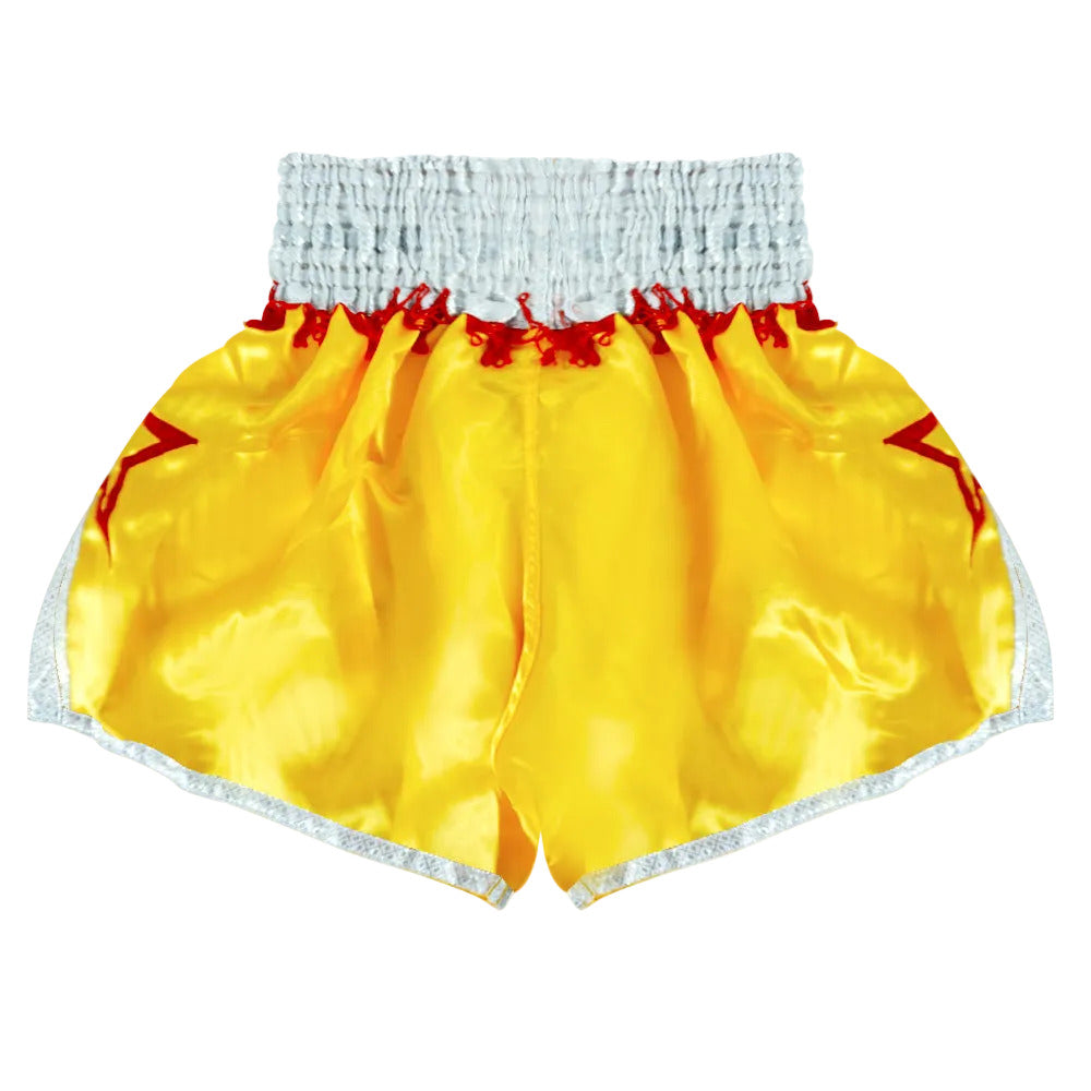 Yellow Boon traditional Muay Thai shorts with red accents and silver trim, back view