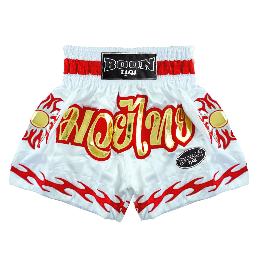 White traditional Muay Thai shorts by Boon with red and gold flame design, Muay Thailand gear