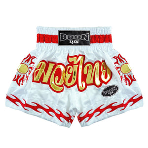 White traditional Muay Thai shorts by Boon with red and gold flame design, Muay Thailand gear