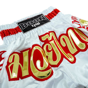 Boon traditional Muay Thai shorts in white with gold and red Thai script, Muay Thailand gear