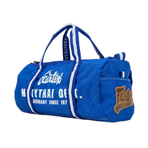 Fairtex blue Muay Thai barrel duffle bag with logo and white straps