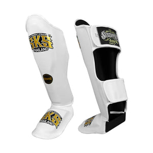 White SKS Empire Muay Thai leather shin pads with logos, front and side view