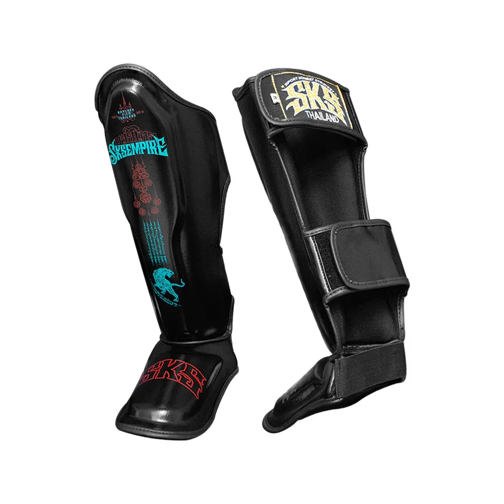 Black SKS Empire microfiber Muay Thai shin pads with tiger design and branding