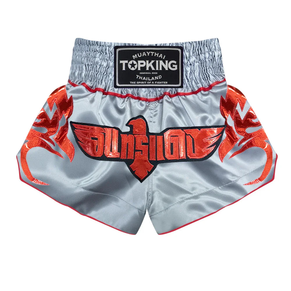 Top King Muay Thai shorts in silver with red eagle design and Thai lettering
