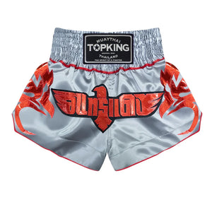 Top King Muay Thai shorts in silver with red eagle design and Thai lettering