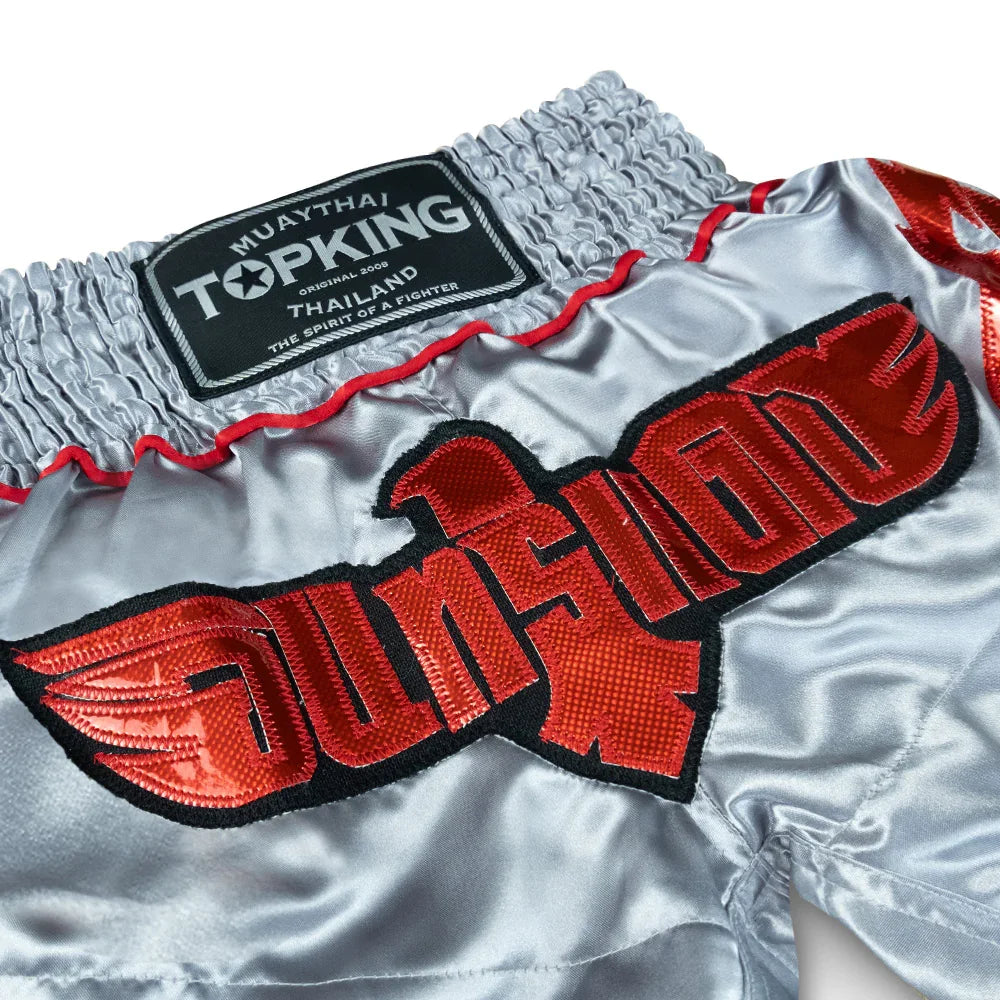 Top King Muay Thai shorts silver with red eagle embroidery and Thailand logo patch