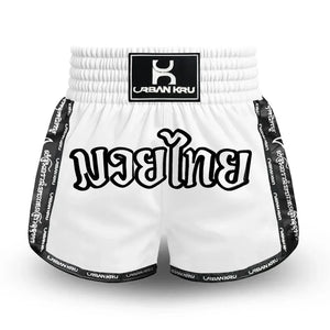White Muay Thai shorts with black trim and Thai script, Urban Kru logo on waistband
