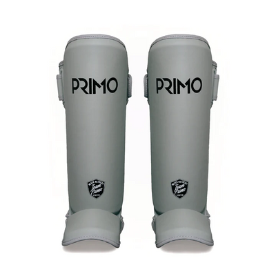 A pair of Primo Muay Thai shin guards in grey